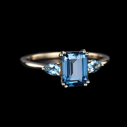 "Sapphire Sparkle: A Dazzling Blue Topaz Ring"