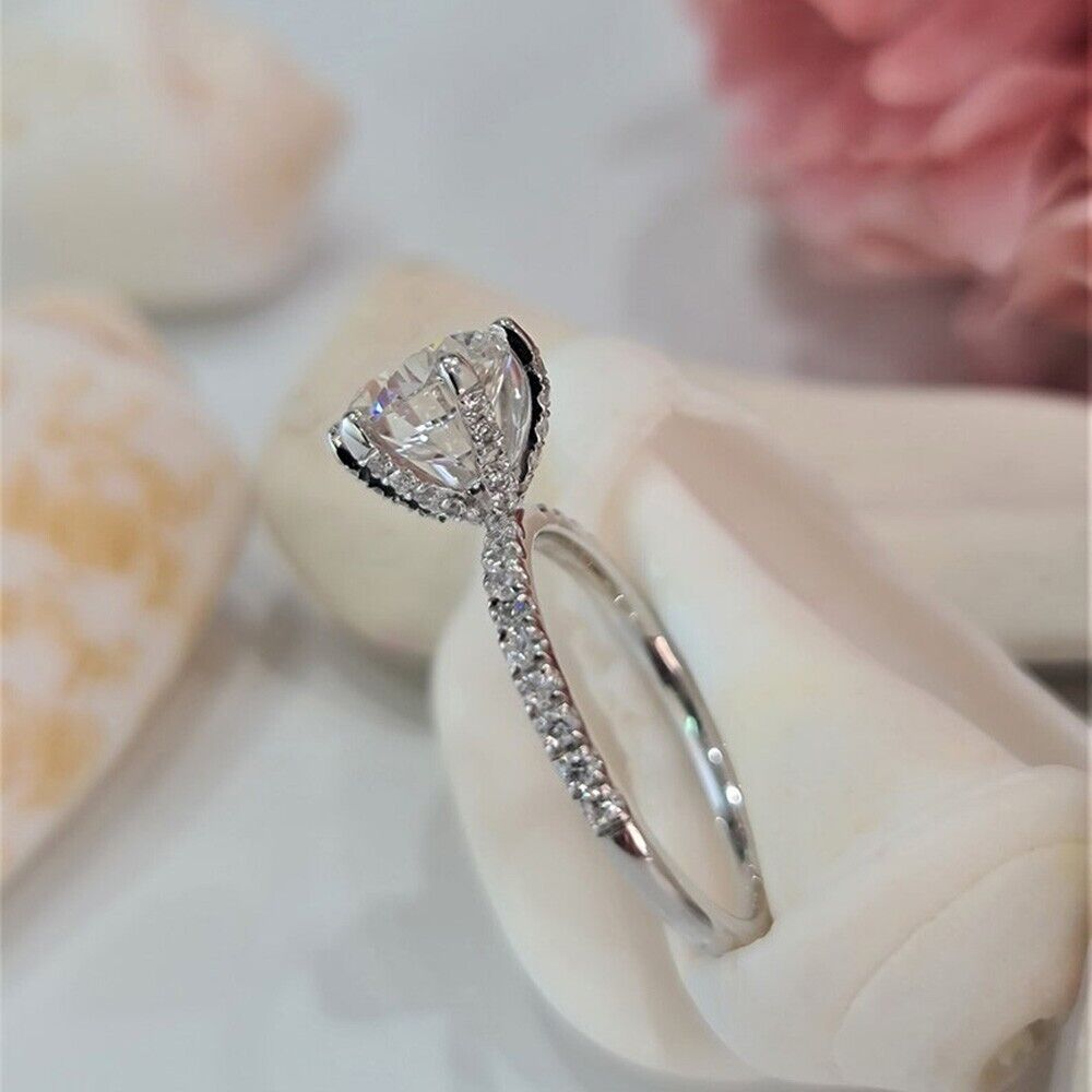 "Luminous Sparkle: A White Zircon Ring with Rhodium Shine"