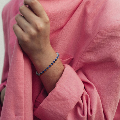 "Dazzling Dreams: Silver Bracelet with Blue Sapphire and Zircon"