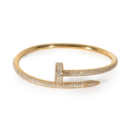 "The round bangle adorned with a sparkling zircon stone."