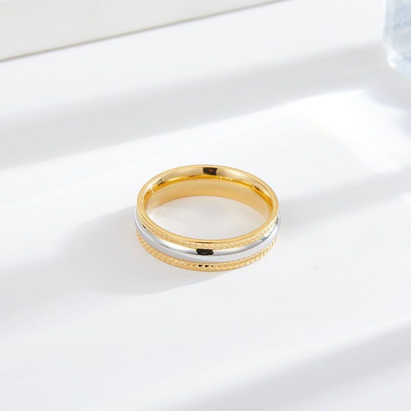 "Sparkling Duo: Gold and Silver Ring for Subtle Glamour"