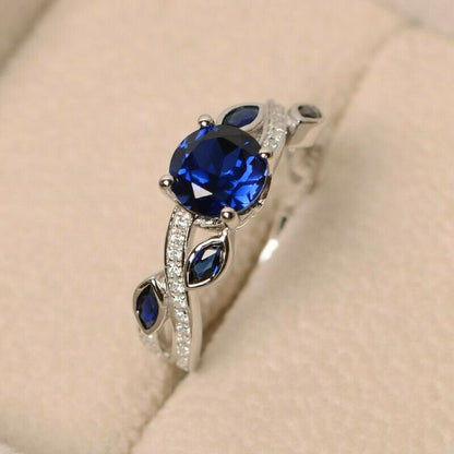 "The Stunning Blue Stone: Sapphire and White Zircon Gemstone Ring" With Additional Diamond