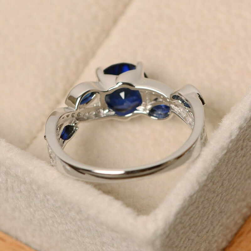 "The Stunning Blue Stone: Sapphire and White Zircon Gemstone Ring" With Additional Diamond