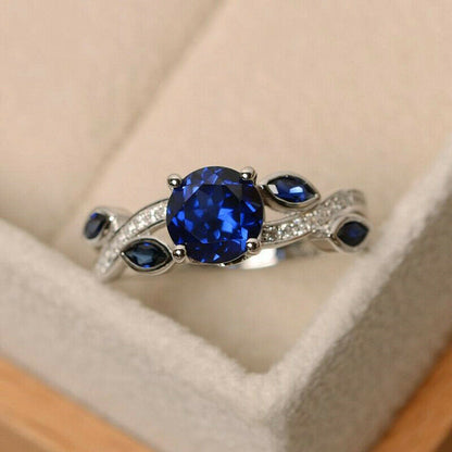 "The Stunning Blue Stone: Sapphire and White Zircon Gemstone Ring" With Additional Diamond